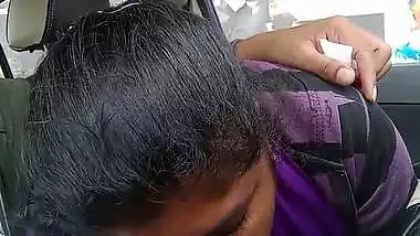 Telugu woman gives a desi blowjob to her man in a car